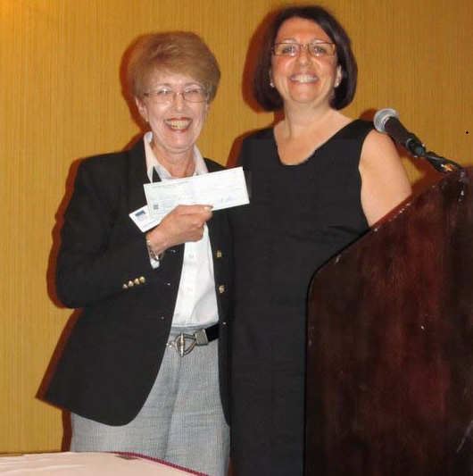 Ellen presenting a check to DRIF